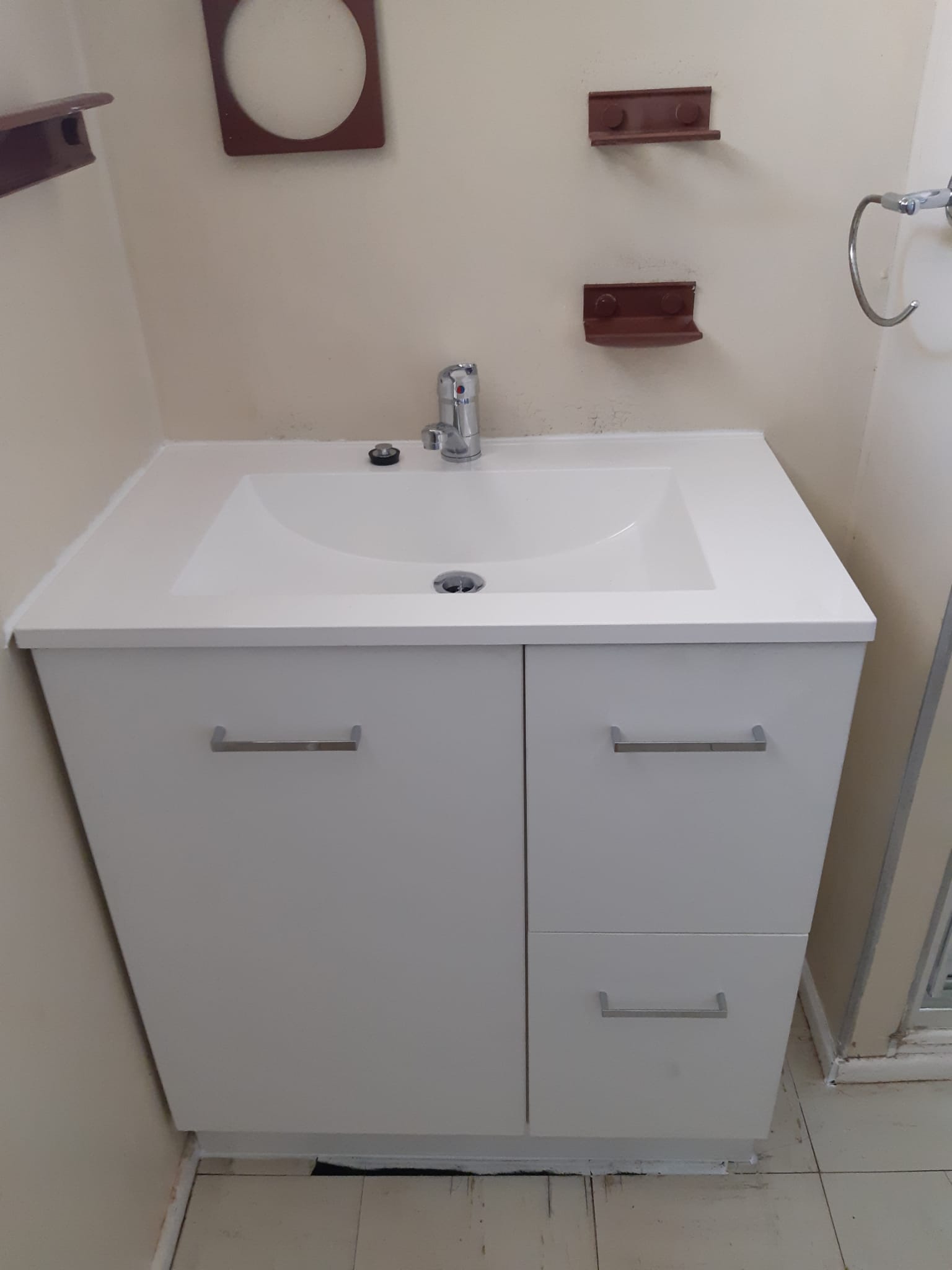 New white bathroom vanity with a lever mixer tap, installed by Easy As Plumbing