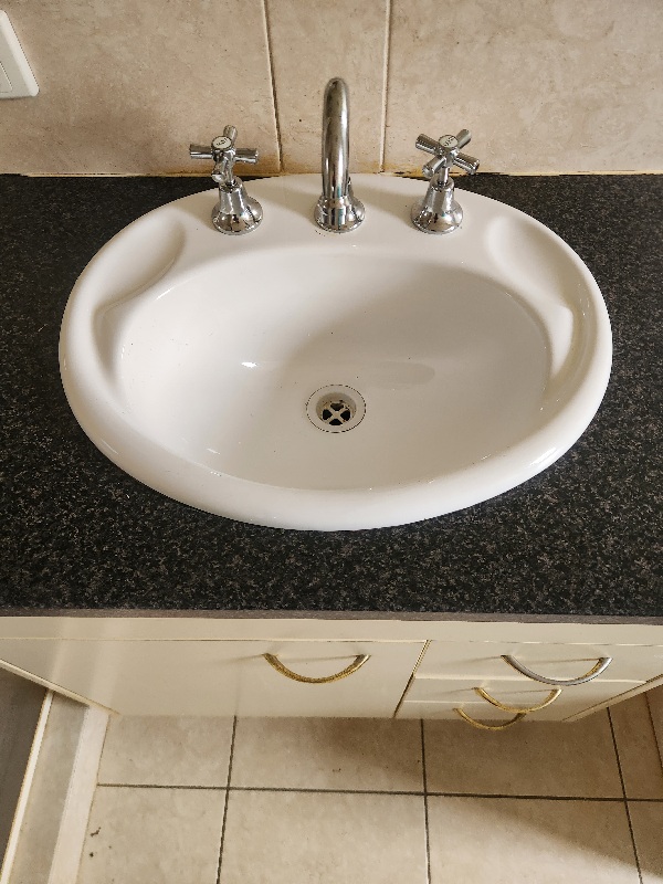 Vanity basin with a new chrome mixer tap