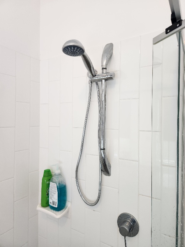Shower rail with handset and a lever shower mixer